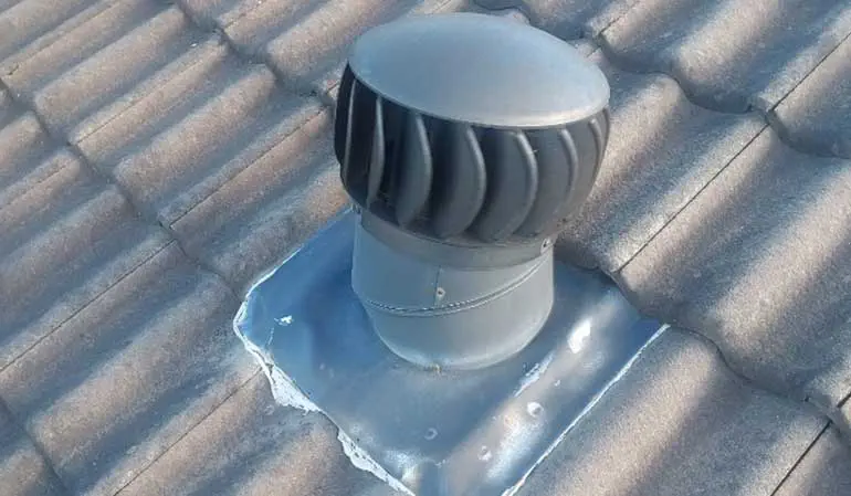 Applying silicone around whirlybirds